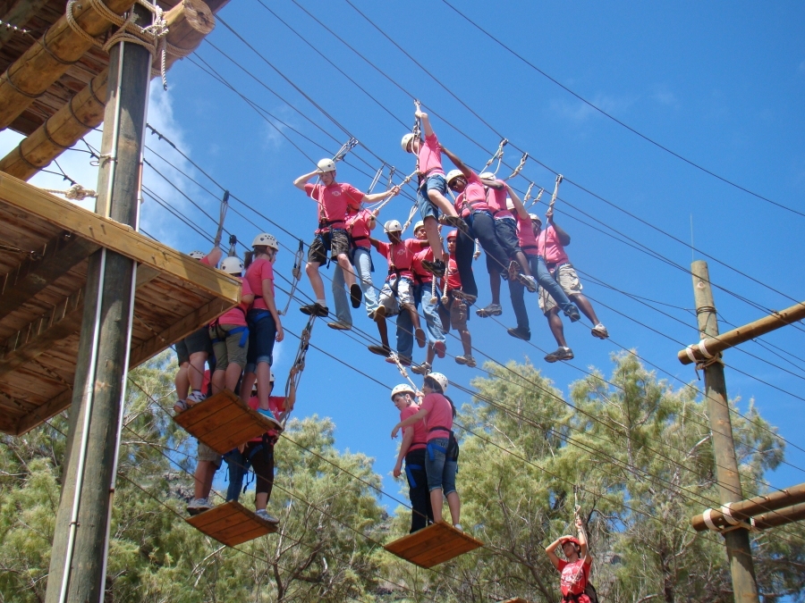 PHOTO CAPTION: Delegates at the Pacific Youth Leadership Forum negotiate a confidence-building exercise at Camp H.R. Erdman, a YMCA camp located on the North Shore in Hawaii. The YLF was sponsored and hosted by Installation Management Command-Paci...