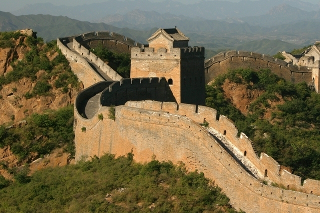 Early morning sun reflected off the Great Wall of China. This is the last tower in the restored section as you travel east from Jinshanling. Near Jinshanling, China, September 2005