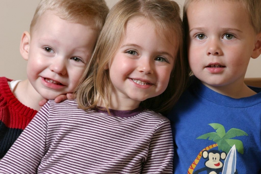 Strobist: Shoot-through umbrella 430ex at 1/4 power up and to my left about 2 to 3 feet from subjects. The cousins get together for a photo shoot at Grandma's house. There was very little cooperation. Note to self: Bribery works better than ...